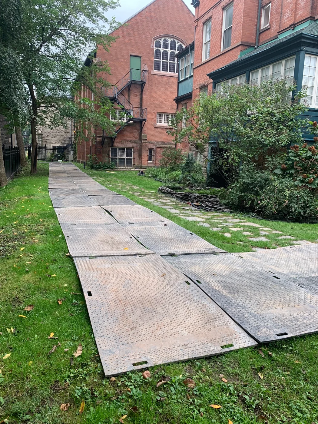 Trak Mat access beside heritage brick buildings